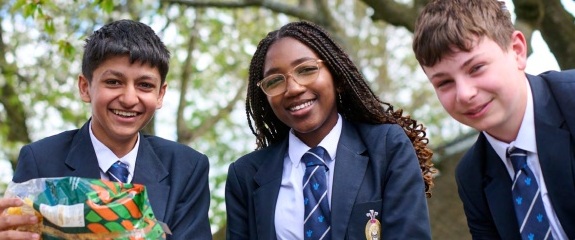 Cover - 3 children cooking pasta outside
